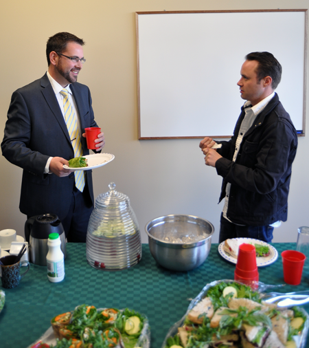 Chris Bostock (left) of Edward Jones chats with EZ Rock's Shaun Aquiline over sandwiches and salads from The Modern. David F. Rooney photo