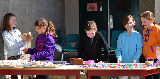Tiffany Brunetti (far right) and her friends Josie, Jaclyn, Rhenna and Taylor selling cinnamon buns and handmade jewellery at lunch at CPE. Photo courtesy of Ariel McDowell