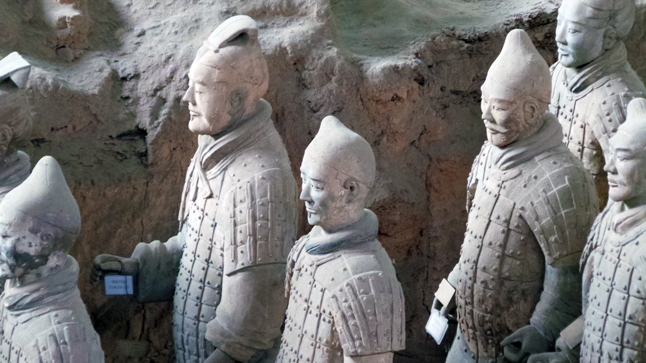 But what really stuck in Mark's imagination were the highly detailed statues of the Terracotta Army. The terracotta figures are life-sized. They vary in height, uniform, and hairstyle in accordance with rank. Most originally held real weapons such as spears, swords, or crossbows. Originally, the figures were also painted with bright pigments, variously coloured pink, red, green, blue, black, brown, white and lilac. The coloured lacquer finish, individual facial features, and weapons used in producing these figures increased the figures' realism. Most of the original weapons were looted shortly after the creation of the army, or have rotted away, while the colour coating flaked off or greatly faded. Mark McKee photo