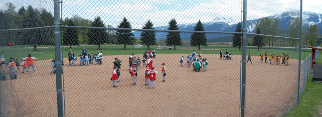The 69 boys and girls of Revelstoke Minor Ball gathered with their teammates and coaches as they arrived at Doug may Field. This is the best turnout of local kids and adult coaches for Minor Ball in years. David F. Rooney photo
