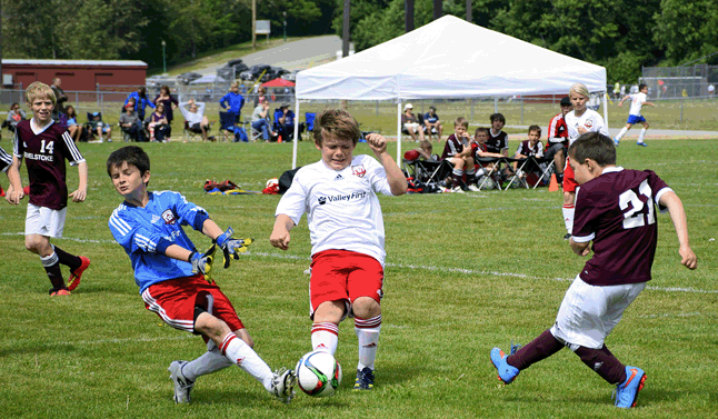 This past Sunday, 13 teams from Kamloops, Kelowna, Vernon, Penticton, and Salmon Arm made the journey to Revelstoke for another Thompson Okanagan Youth Soccer League (TOYSL) Jamboree. Here's a shot of Jonah Adam worring the Kelowna defence. Eleanor Wilson photo
