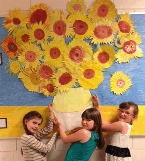 Sterwardson, Natalia Morrone, and Emma Mair showed off their strength in art with this beautiful bulletin board display inspired by Vincent Van Gogh.  Each flower was painted by a student in Jackie Uremovich’s Grade 2/3 class at Arrow Heights Elementary School. Photo by Amelie Delesalle Caption by Amelie Delesalle and Emily MacLeod