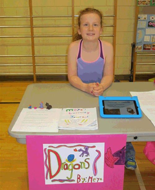 Meya Musseau told us about dragons at the Curiosity Project display. Todd Hicks photo. Caption by Amelie Delesalle 