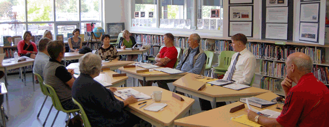 SD 19 trustees passed a $12,994,939 budget for the 2015/2016 school year at their regular monthly meeting, held on Wednesday, May 27, at Begbie View Elementary School. Here they talk with BVE Principal Yanping Wang (center, left) about her annual report on student progress. The board was very pleased with the leadership skills the students are learning at the school. David F. Rooney photo