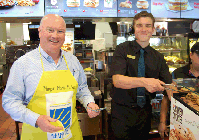 Mayor Mark McKee was one of several local VIPs invited to help out at McDonald's during its annual McHappy Day event. McHappy Day is aimed at raising money to support local charities as well as the corporation's network of Ronald McDonald Houses that offer a place to stay for  families with very sick children in hospital. David F. Rooney photo