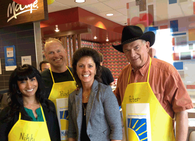 Cathy poses with another crew of willing and smiling VIPs. May 6, 2015, marked the 22nd McHappy Day in McDonald's Canada’s history. Since McHappy Day was introduced in 1977, the national one-day fundraising event has raised more than $46 million for Ronald McDonald House Charities (RMHC®) Canada, the Ronald McDonald House and local children’s charities across Canada. Throughout the year, McDonald's donates 10 cents from every Happy Meal sold to RMHC Canada. First celebrated in Canada, McHappy Day is now a worldwide event that unites McDonald’s restaurants globally in support of children in need in local communities. David F. Rooney photo