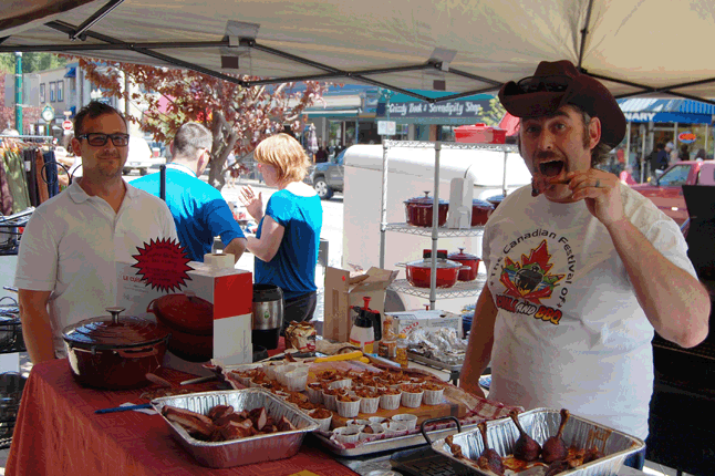 BBQ Pro Glen Cherlet prepares to chow down on one of his culinary creations as his pal Trevor English looks on. Glen, who is the chef across the river at the Big Eddy Pub, was offering samples of his barbecues chicken drumsticks, pulled pork, brisket and more. Gosh. it was soon good. David F. Rooney photo