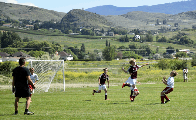 Brodie Patry heads the ball over his opponent. Eleanor Wilson photo