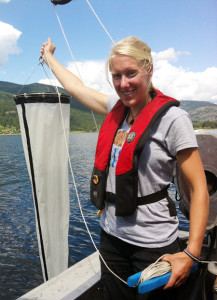 Columbia Shuswap Invasive Species Society (CSISS) Program Assistant Laura Gaster samples Shuswap Lake, looking for invasive zebra and quagga mussels. They have not been found in BC, but have caused devastating impacts on lakes in the Eastern provinces and Southern states. Photo courtesy of the Columbia Shuswap Invasive Species Society
