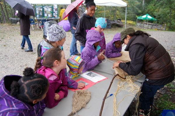 Aboriginal Education Assistant showed curi9us children how manyt of BC's First Nations people wove nets. David F. Rooney photo