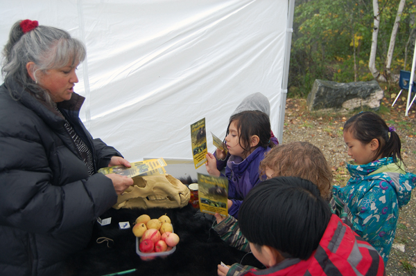 Bear Aware Coordinator Sue Davies hands out pamphlets to some of the children. David F. Rooney photo