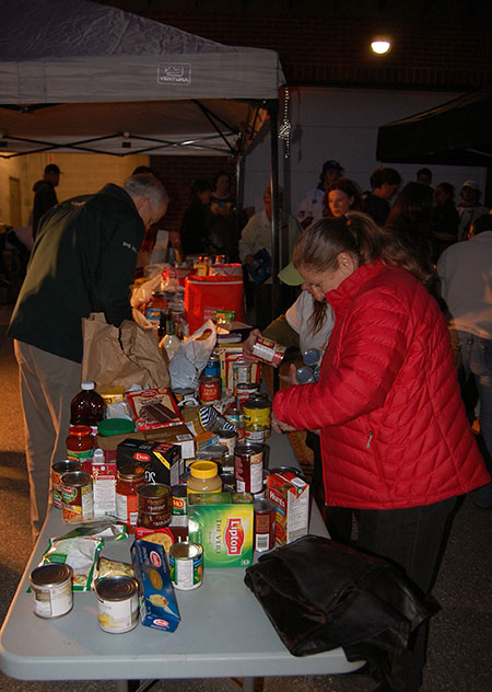 Collecting food and cash donations was just the first part of this massive city-wide campaign. Everything was dropped off at the RCMP detachment where volunteers like Carol Palladino sorted everything for later storage. David F. Rooney photo