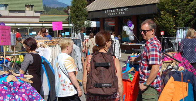 Elmer Rorstad of Free Spirit Sports chats with a potential customer during the Heritage Weekend Sidewalk Sale. David F. Rooney photo