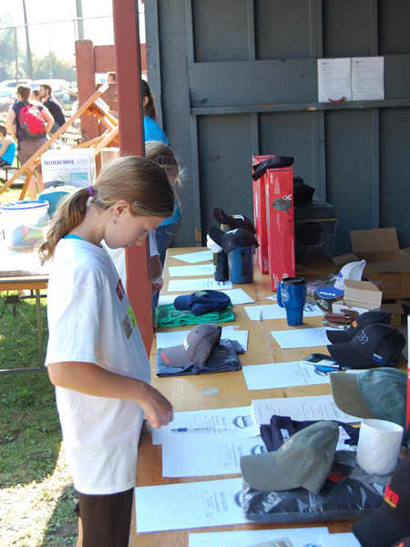 The items in the silent auction at Centennial Park attracted all kinds of bidders. David F. Rooney photo
