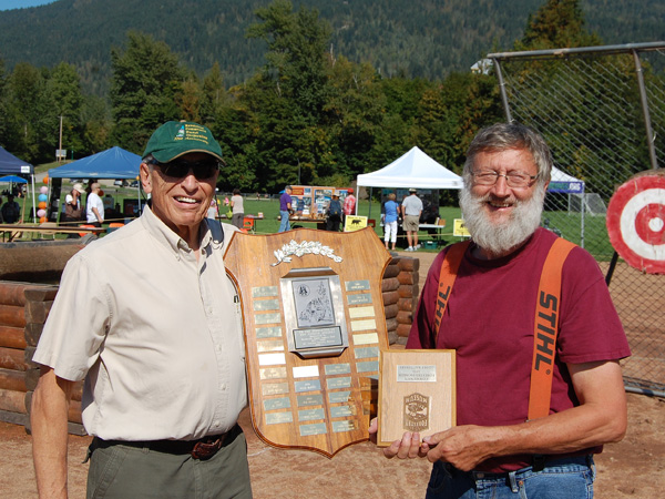 Geoff Battersby (let) was recognized by the BC Interior Forestry Museum and Discovery Centre as this year's Community Pioneer Logger. Museum Chairman Brian Sumner said Battersby deserved the award for his work to establish the Community Forestry Corporation. A retired physician and former mayor Battersby is widely regarded as a model citizen because of that as well as work with the Community Energy Corporation, the Community Foundation and other organizations. David F. Rooney photo