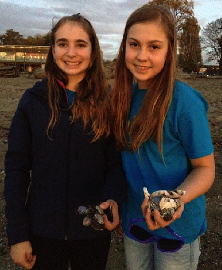 Arianna Morrone and Hunter Stewardson collecting shells at  Kitsilano Beach during a side trip from We Day, Vancouver, 2015. Photo by Ms. Tara Johnson. Caption by Emily MacLeod and Amelie Delesalle 