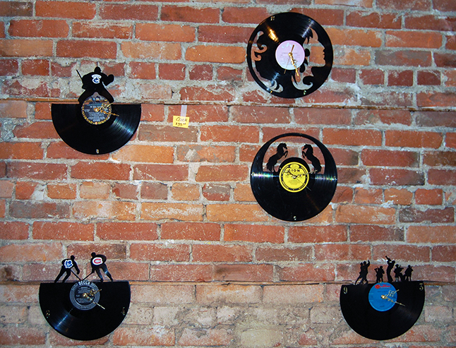 I was in Conversations this week week and spotted these very cool clocks made from old LPs by local artist Carol Silano.  Give some time to think about it and they can always come up with creative way to re-purpose obsolete or fashion-challenged objects. Great idea Carol! David F. Rooney photo