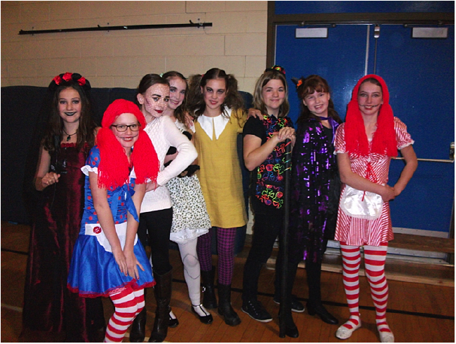 Here is Jade Davies, Rebecca Grabinsky, Sonia Rosenberger, Arianna Morrone, Hunter Stewardson, Sam Brown, Andie Reynolds, and Amelie Delesalle, dressed up for the Halloween Dance at Arrow Heights Elementary School. Photo and caption by Emily MacLeod and Amelie Delesalle AHE Student Reporter-photographers 