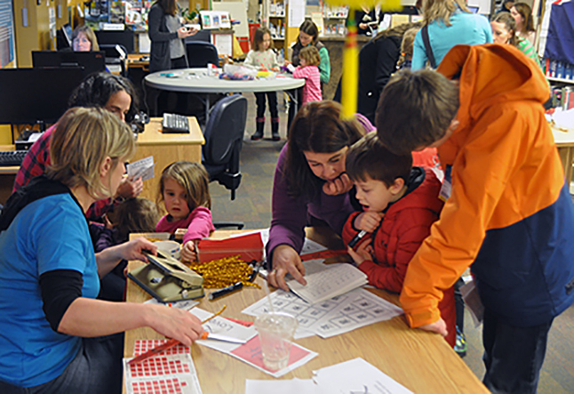 The Revelstoke branch of the Okanagan Regional Library fairly vibrated with activity as children played games and made crafts during the Carousel of Nations. David F. Rooney photo