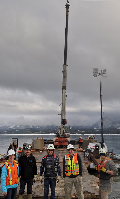 Jennifer Walker-Larson poses for a photo with project staff Bill Illidge, Steve Degenerness, Michael Boruch and Dylan Maltby. Peter Bernacki is on the far background talking with another member of the work crews. David F. Rooney photo