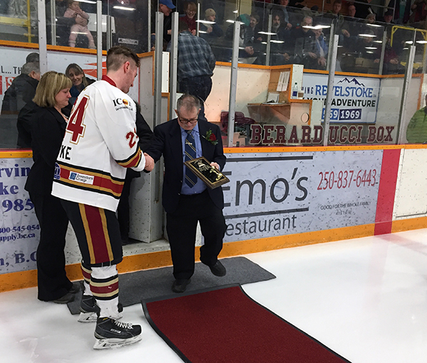 Grizzlies Captain Kenny Batke helps Dennis on to the red carpet Check out the lettering on the Penalty Box it has been renamed the Berarducci Box. David F. Rooney photo