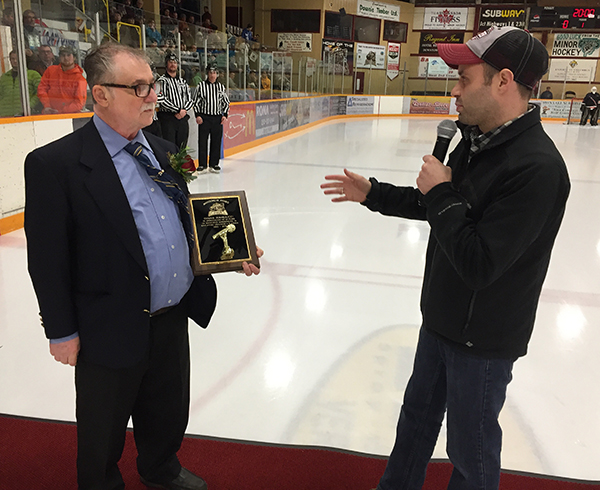 Master of Ceremonies Shaun Aquiline congratulates Dennis on his many accomplishments. David F. Rooney photo