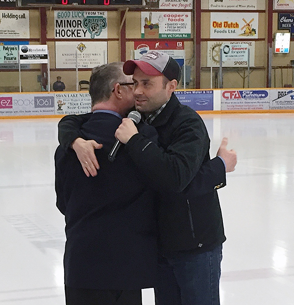 Overcome with emotion, Dennis gives Shaun a hug at the end of the ceremony. David F. Rooney photo