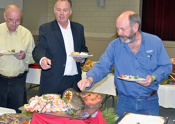 MLA Norn Macdonald was guest of honour at the banquet and certainly brought a healthy appetite. It looks like he was particularly interested in the salmon. David F. Rooney photo 