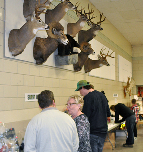 The silent auction saw a lot of bidding on outdoor gear, fishing and hunting equipment. David F. Rooney photo