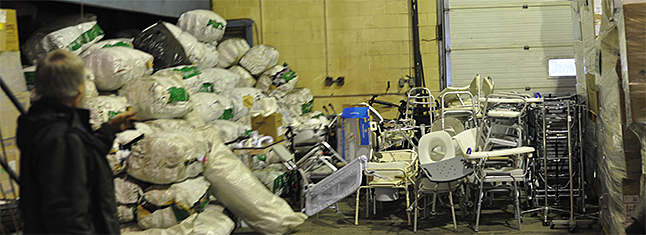 These may look like random piles of 'stuff,' but they are much more than that. The boxes on right are some of the 1,000 boxes of medical supplies donated by Interior Health. Then there are special medical devices, bedpans and other items in the center and the bales contain clean clothes, tenting and other badly needed items. David F. Rooney photo 