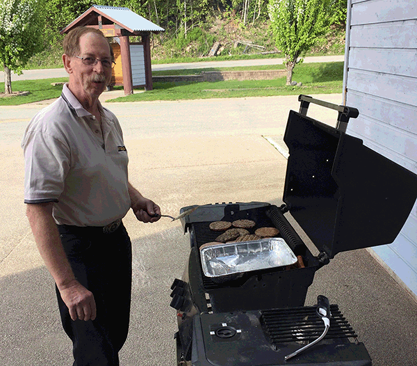 Barry Ozero flipped burgers for a good cause at the Revelstoke Heritage Railway Society's recent Annual General Meeting. David F. Rooney photo