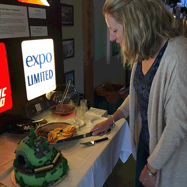 Wendy Harper prepares to cut the railway-themed cake. David F. Rooney photo 