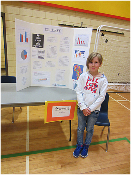 This is Clara Kenyon sharing her project on child poverty. Todd Hicks photo. Caption by Emily MacLeod and Amelie Delesalle