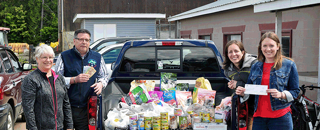 Barton's Insurance went to bat for the Revelstoke & District Humane Society in a big way this spring by sponsoring a food drive to help feed the animals at the their shelter. Barton's Manager John Grass drove to the shelter the other day to drop off 317 pounds of wet and dry pet food, plus $317 in matching funds put up by the agency as well as some cash donations from their clients. Not surprisingly, Gail Piatelli (left), Sami Lingren and Shannon Van Goor were very pleased by this. Please click on the image to see a larger version. David F. Rooney photo