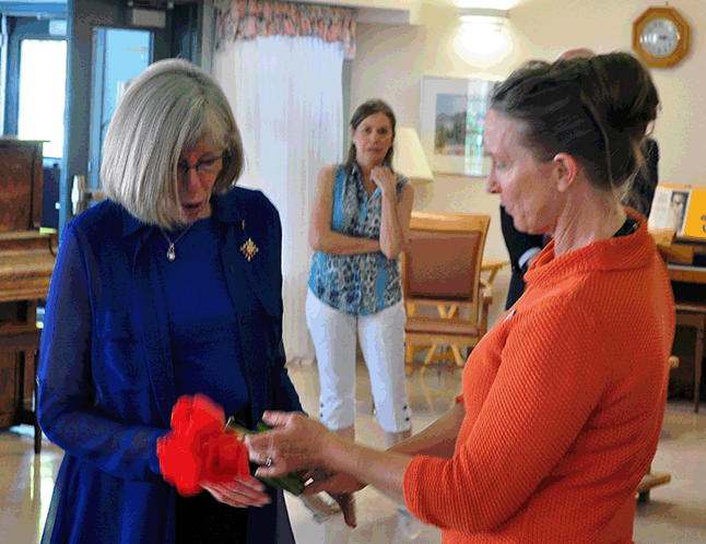 Lieut.-Gov. Judith Guichon was surprised and gratified by the tulips presented to her at Mober;ey Manor by Lorelei Leflar on Tuesday. The Queen's representative in British Columbia was in town as part of a tour that included visits to Salmon Arm, Sicamous, Revelstoke and Golden. David F. Rooney photo