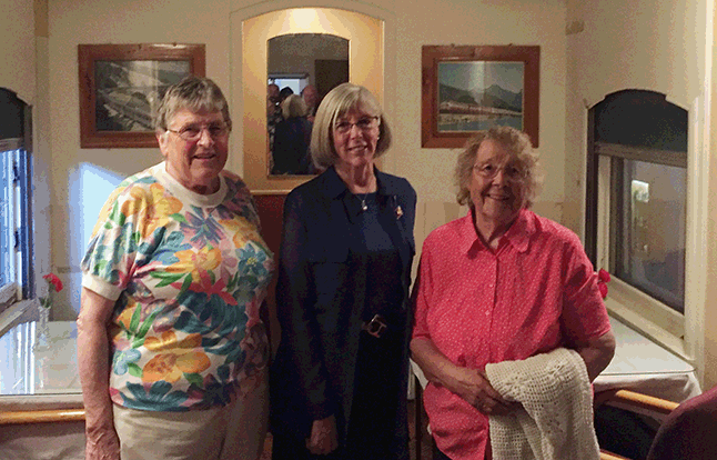 Myrna Robinson and Lorna Duncan, both volunteers with the Revelstoke Railway Museum pose with the Lieutenant Governor in the Club Car during her tour of the museum. David F. Rooney photo