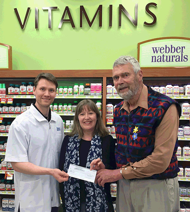People's Drugmart proprietor David Lafreniere (left) poses with QVH Administrator Julie Lowe and Bill Shuttleworth of the Hospital Foundation as he presents Julie with a $1,000 cheque. The generosity shown by David and many, many other Revelstokians raised a whopping $16,207 for new equipment at the hospital. David F. Rooney photo