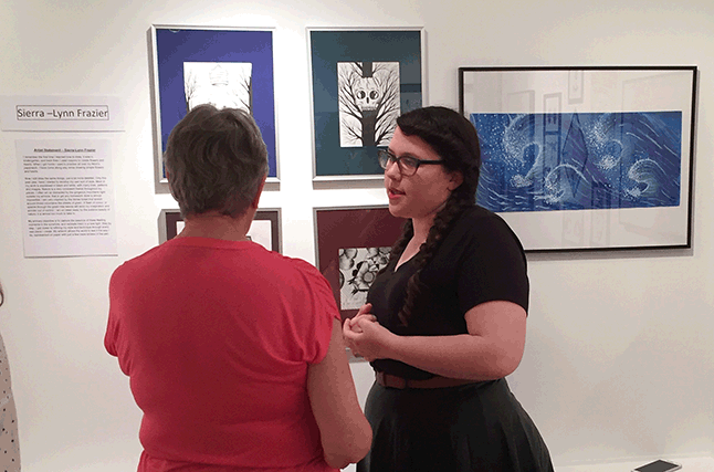 Watercolourist Sherrin Davis, who was showing work in the Golden Girls' show, talks with RSS art student Sierra-Lynn Frazier. David F. Rooney photo