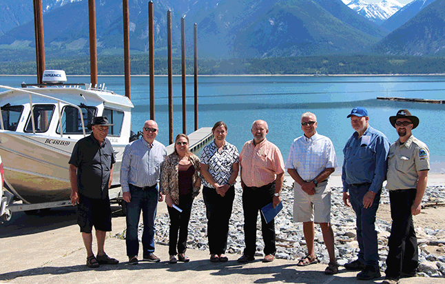 Energy, Mines and Natural Resources Minister Bill Bennett (center) poses with CSRD Directpr Loni Parker (third from the left), Mayor Mark McKee and others at the newly completed boat ramp at Shelter Bay Provincial Park. The $1.38 million upgrade included breakwaters and a floating dock. “The upgrades to the Shelter Bay boat ramp will provide boaters with improved access to Arrow Lakes Reservoir for many years to come," Bennett said in a statement. "I’d like to congratulate BC Hydro, the construction team, and all the stakeholders who came together to make this boat ramp better and safer.” Photo courtesy of BC Hydro