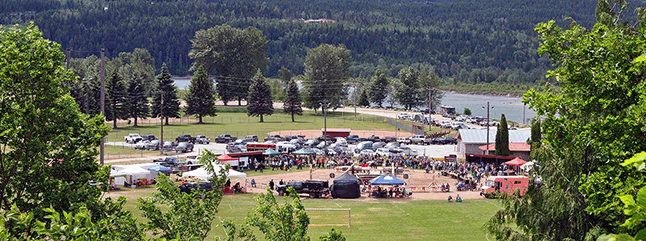 Heritage Week got off to a terrific start this past weekend with a very large turnout for this year’s Timber Day event. Well over 300 people came to watch the logger sports events and enjoy the weather at Centennial Park. And there's more going on this week! The turnout at Timber Day was very gratifying for the Forest Works' Society, which organ ized it. “I think bringing back the pro show was a big advantage,” the Forest Workers’ Society’s Nadine Overwater told The Current. “The locals were excited to see the pro show. The weather actually worked out in our favor as well, I think it being so nice so early on in the season a lot of people had already gone out camping in the weeks before and so decided to stay home for the long weekend. It was supposed to rain, too, so a good weekend to stick around the locality and take in the events. We did a big media push this year and with the help of all the volunteers and local businesses really got the word out.” Click here to see a larger version of this image. (You can even try to count the people in the crowd!) David F. Rooney photo