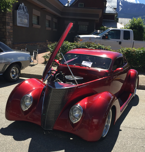 How do you like this ruby-red five-window Ford Coupe from 1937? Judging by its gleam it is the pride and joy of owners John and Helena Kernaghan of Enderby. David F. Rooney photo