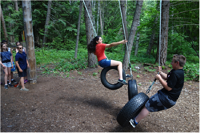 Here are Cassidy Legebokow and Michael Mierstch doing the tire course at low ropes. Ron Larson photo. Caption by Emily MacLeod, Amelie Delesalle, and Rebecca Grabinsky