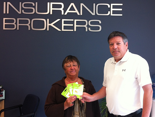 Carol Cameron poses with John Grass at Barton’s Insurance Brokers. She recently won $300 in Save on Foods gift cards when she entered the new HUB International office on Victoria Road. Photo courtesy of Barton’s Insurance Brokers