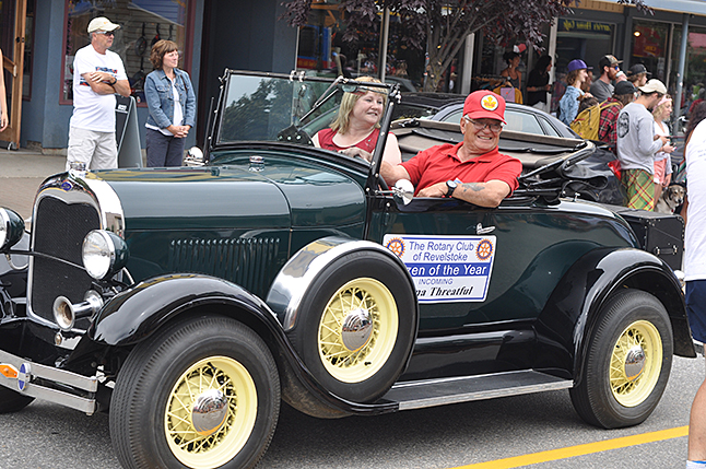 Citizen of the Year Roma Threatful smiles to the crowd of friends and neighbours who cheered her on Hector Scatcelli's antique car. David F. Rooney photo