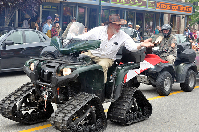 George Buhler has a quick word with some of the parade observers. David F. Rooney photo