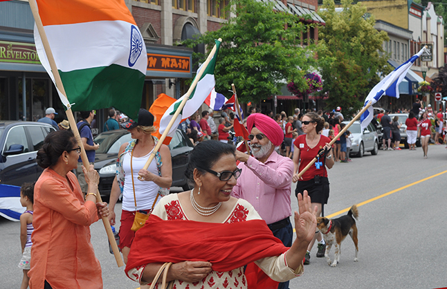 Pam Sanghera waves to a friend in the crowd. David F. Rooney photo