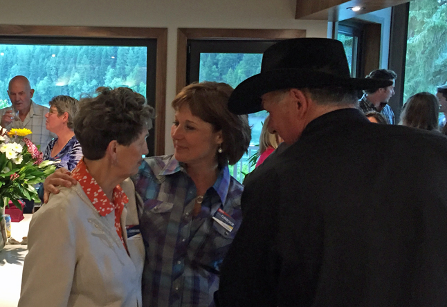 Edie Schleiss talks with Clark in Peter's kitchen. David F. Rooney photo