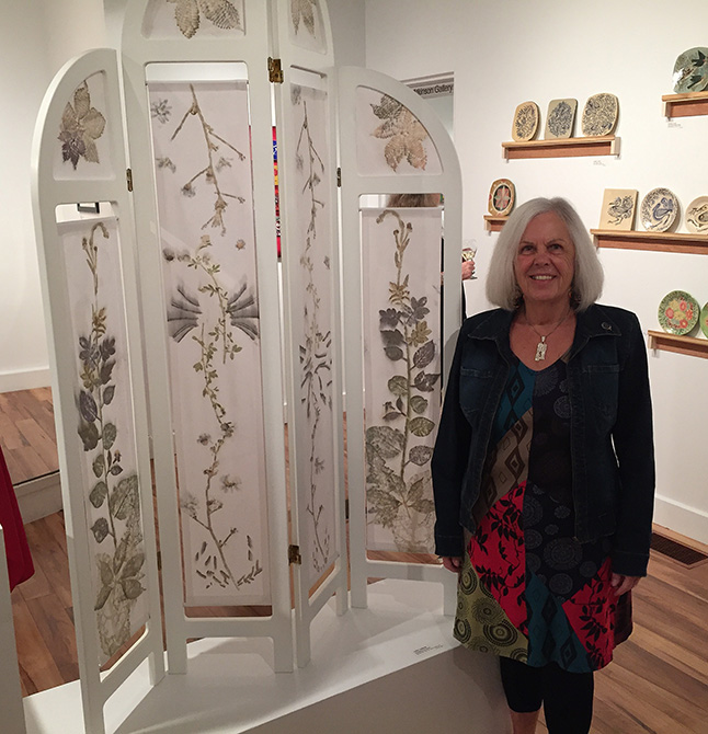 Akira Hansen poses beside her lovely fabric screen, entitled Homage to Frances. David F. Rooney photo