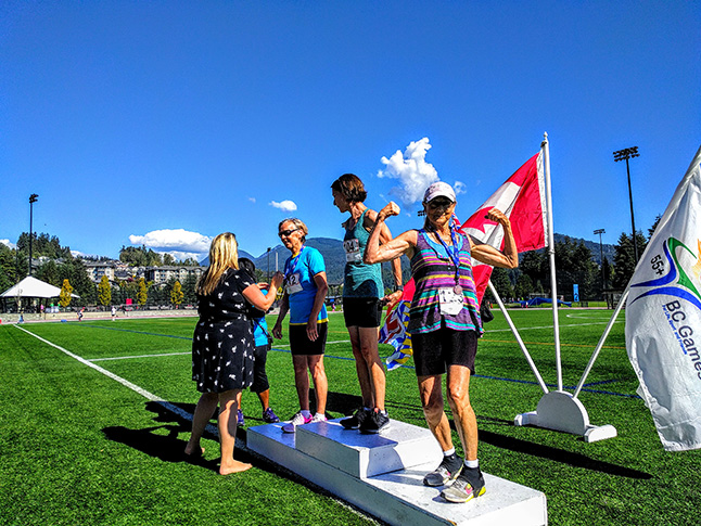 Showing a little girl power, Revelstoke's BJ Little is over-the-moon ecstatic at placing second in the 10 km run at the 55+Games recently in Coquitlam. She also ran away with a bronze and two more silver medals. Photo courtesy of Barbara J Little